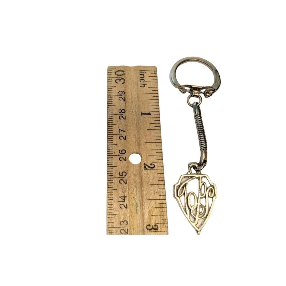 Gold-Tone Metal Keychain With Intricate Monogrammed Design And Spring Detail - Picture 5 of 5